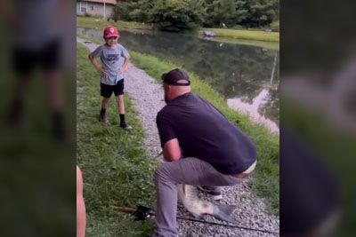 Father Gets Slapped By Large Fish