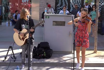 Teenagers Perform 'Imagine' By John Lennon During The Street Performance