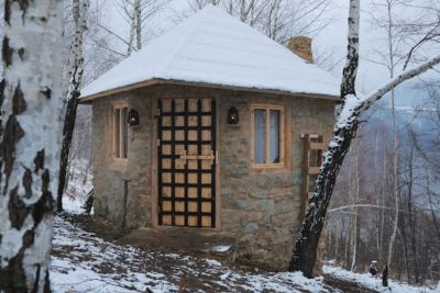 Man Builds A Stone House In The Woods