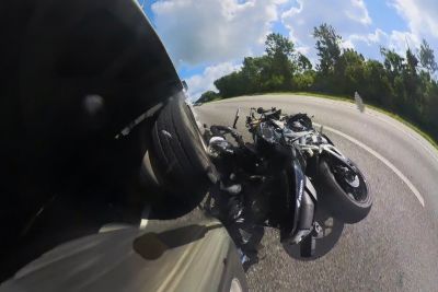 Speeding Motorcyclist Crashes Into A Car, Gets Run Over By A Truck