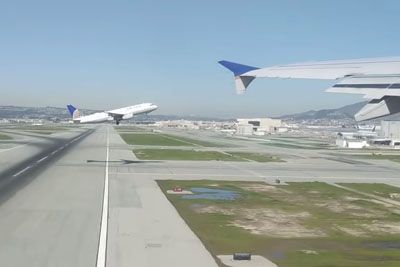 Two Passenger Planes Take-Off At The Same Time