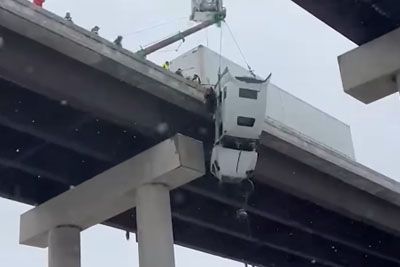Truck Driver Rescued From Truck Hanging Off Bridge