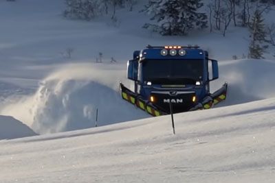 Truck plowing snow on Norwegian mountain