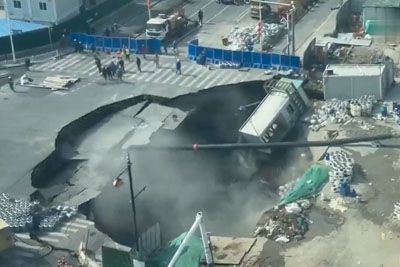 Ground collapses in Shanghai, massive sinkhole swallows busy road