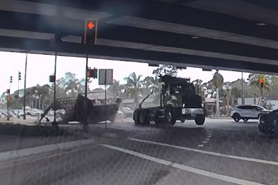 Truck slams into overpass in Florida, cargo crashes down