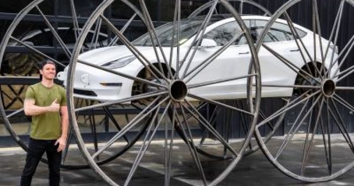 Driving A Tesla Upside-Down On 10 Ft Tall Wheels | Klipland.com