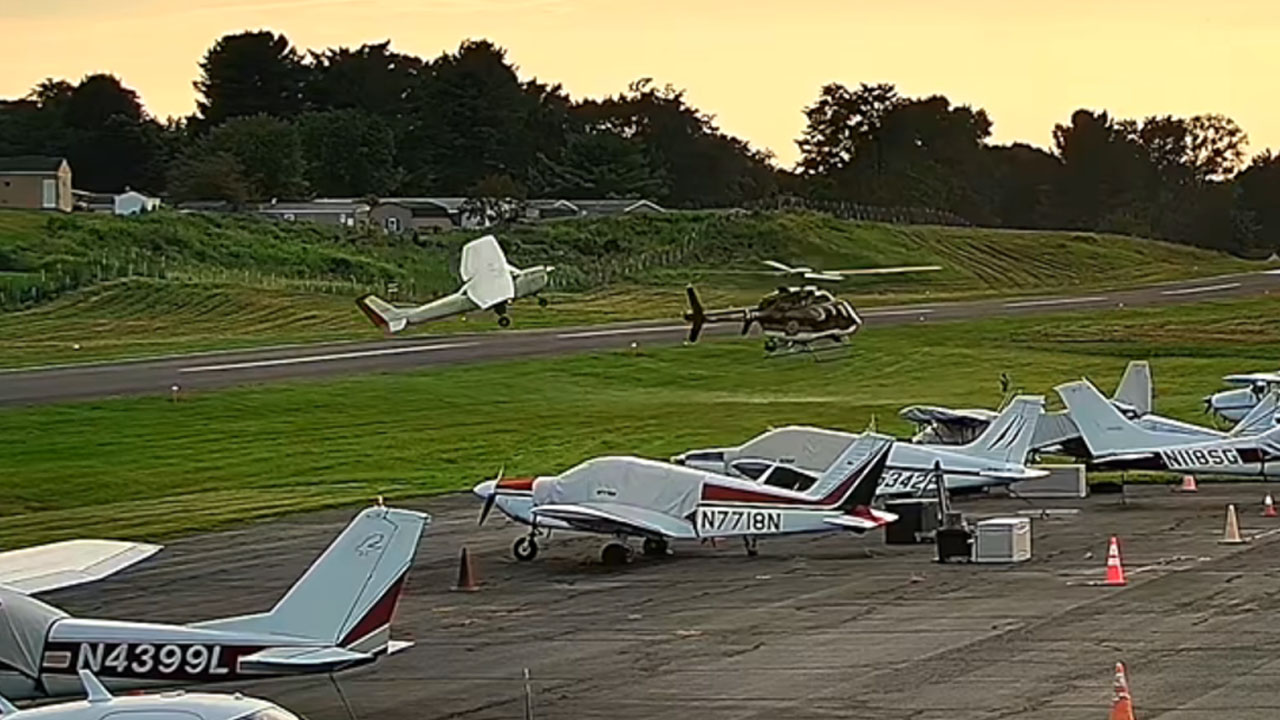 Airport surveillance cameras captured the plane and helicopter crash